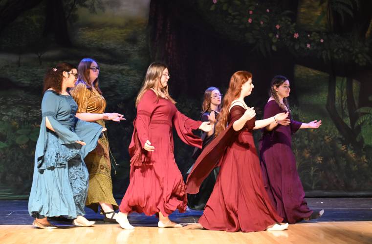 The Fawning Ladies glide across the stage during rehearsal for Greenfield High School’s production of “The Somewhat True Tale of Robin Hood.”