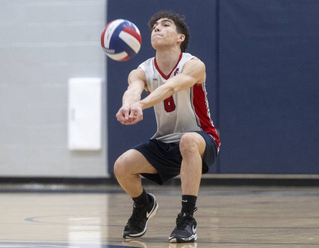 Frontier's Nathan Rivera bumps the ball during the volleyball game against Belchertown at Frontier High School, Thursday, April 24, 2025, in South Deerfield.
