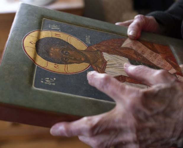 A range of art by Peg Holcomb includes religious icon portraits using egg tempera, a tradition of Greek Orthodox representation of great saints.