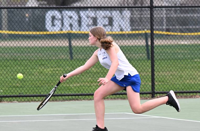 Mohawk Trail’s Anneke Whitsett returns a volley to Greenfield’s Izzy Semomelli at the Davis Street Courts in Greenfield Friday.