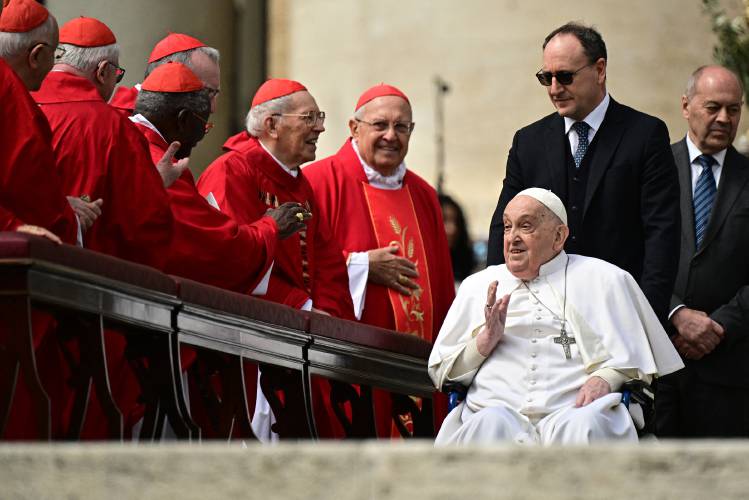 Pope Francis greets cardinals during a surprise appearance at the end of the mass for Palm Sunday at St Peter's square in the Vatican on April 13, 2025. Pope Francis greets cardinals during a surprise appearance at the end of the mass for Palm Sunday at St Peter's square in the Vatican on April 13, 2025.