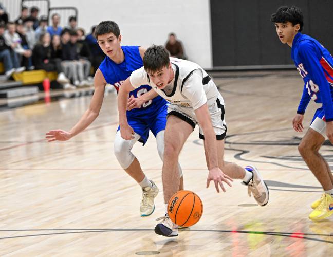 Pioneer’s Brayden Thayer splits two Drury defenders during the Panthers’ Hampshire League South victory at Messer in Northfield on Thursday.