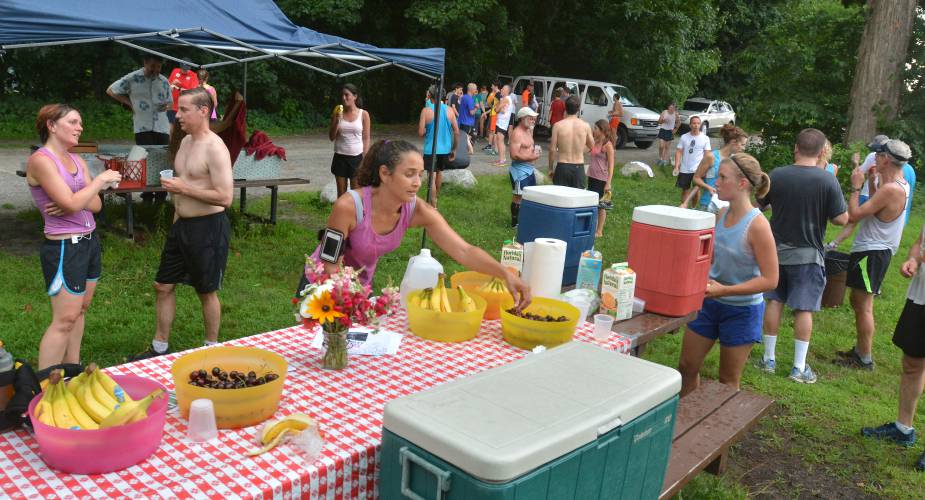 Runners wind down from a past Sugarloaf Mountain Athletic Club 5K run  at Northampton Community Gardens.