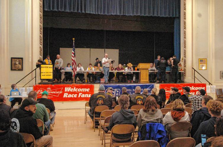 Racers wait to find out their position at the drawing at Athol Town Hall on Friday night before the 59th running of the River Rat Race.