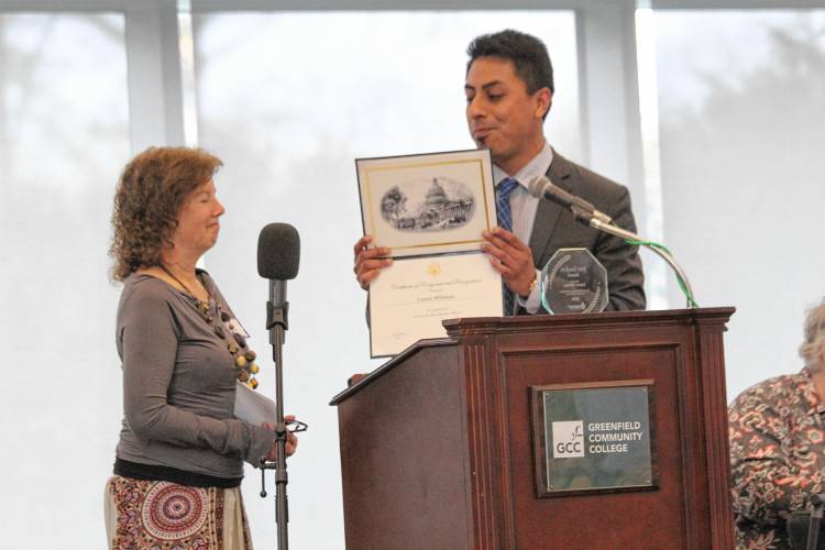 Center for New Americans Executive Director Laurie Millman accepts a congressional citation from Koby Gardner-Levine, U.S. Rep. Jim McGovern’s regional manager, at Community Action Pioneer Valley’s 2024 annual meeting and 60th anniversary celebration Friday morning at Greenfield Community College.