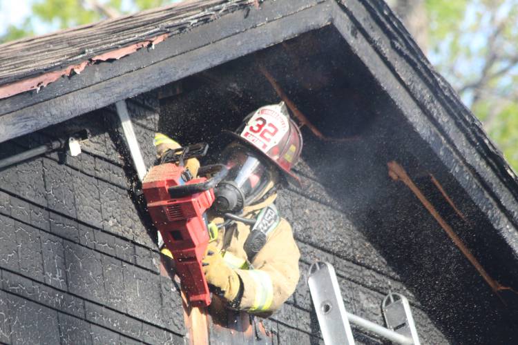 A fire at 88 Phillips St. damaged a home and garage Thursday evening. Firefighters knocked down the blaze in about 15 minutes, according to Greenfield Fire Chief Robert Strahan.