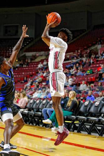 UMass guard Jaylen Curry (2), right, hits a three-pointer over CCSU guard Davonte Sweatman (3) earlier this season at the Mullins Center in Amherst. UMass guard Jaylen Curry (2), right, hits a three-pointer over CCSU guard Davonte Sweatman (3) earlier this season at the Mullins Center in Amherst.