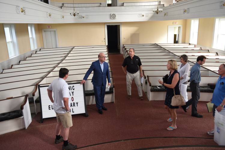 U.S. Rep Jim McGovern, second from the left, tours the former South Deerfield Congregational Church in July 2022. Despite the South County Senior Center’s three member towns having received a $75,000 grant in December 2022 to conduct a feasibility study on the church to see if it could serve as the center’s long-term home, a study has yet to be conducted as the grant’s expiration date approaches this summer. U.S. Rep Jim McGovern, second from the left, tours the former South Deerfield Congregational Church in July 2022. Despite the South County Senior Center’s three member towns having received a $75,000 grant in December 2022 to conduct a feasibility study on the church to see if it could serve as the center’s long-term home, a study has yet to be conducted as the grant’s expiration date approaches this summer.