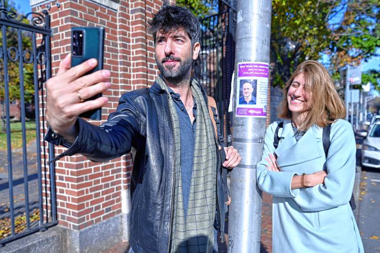 Peace activists Alon-Lee Green, who is Jewish, and Sally Abed, a Palestinian Israeli, take a selfie Nov. 15 at Harvard University in Cambridge.