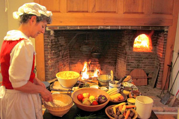 Nancy Parland prepares a meal at the hearth during a previous Colonial Day, offered by the Buckland Historical Society at the Wilder Homestead. This year’s Colonial Day will be held Sunday, Oct. 13, from 2 to 5 p.m. Nancy Parland prepares a meal at the hearth during a previous Colonial Day, offered by the Buckland Historical Society at the Wilder Homestead. This year’s Colonial Day will be held Sunday, Oct. 13, from 2 to 5 p.m.