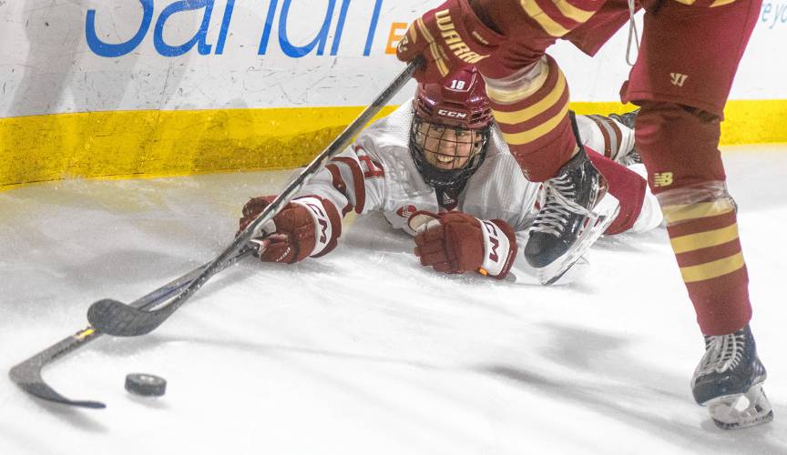 UMass defenseman Larry Keenan (18) dives for the puck during the college hockey game against Boston College at the Mullins Center, Saturday, Feb. 15, 2025, in Amherst.