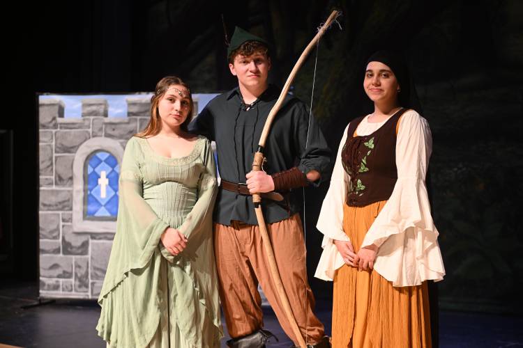 April Rooney Adams as Maid Marian, Camden Toponce as Robin Hood and Kanza Nasrullah as Towns Gal during rehearsal for Greenfield High School’s production of “The Somewhat True Tale of Robin Hood.”