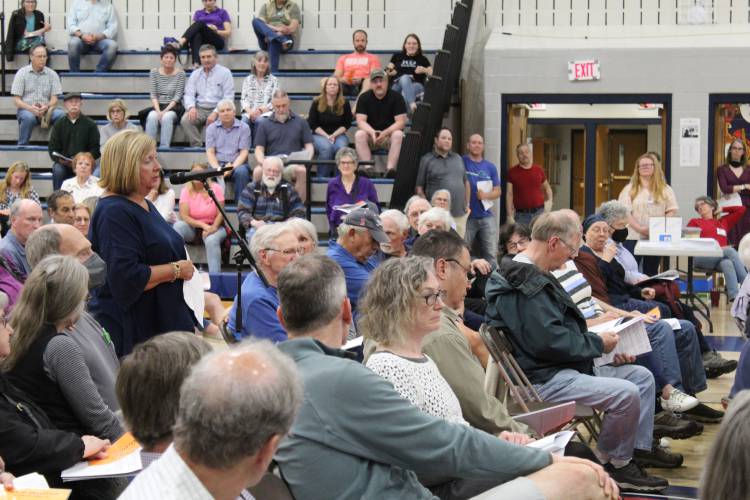 Deerfield resident Charlene Galenski speaks at Monday’s Annual Town Meeting at Frontier Regional School against a citizen’s petition that sought to lower Deerfield’s municipal voting age to 16. The measure was rejected by voters, 107-194.
