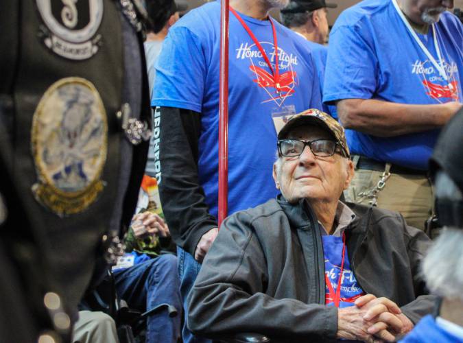 World War II veteran Lee Evers of Montague looks up at a member of the Connecticut Patriot Guard Riders during the send-off ceremony the morning of his Honor Flight to Washington D.C. on Saturday, May 3. 