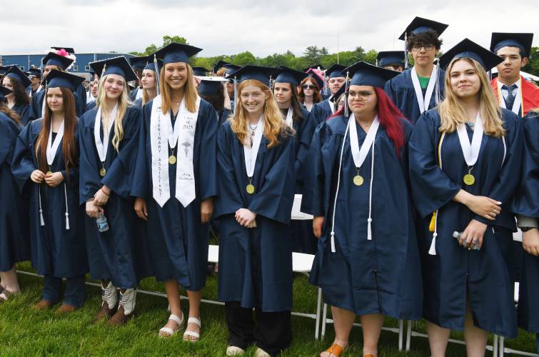 Franklin County Technical School students stand during graduation ceremonies in Montague on Thursday evening.