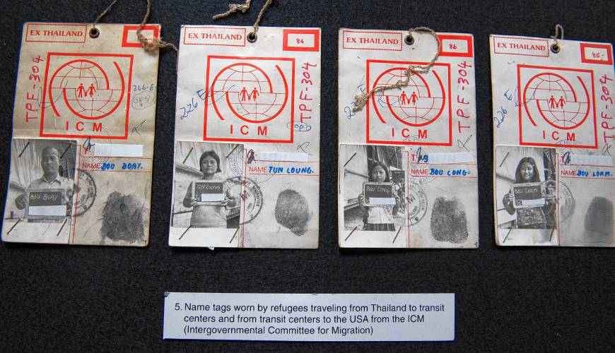 Name tags with photo IDs, which Cambodian refugees had to wear during their journey from refugee camps to the U.S, are part of the new exhibit “Cambodians in Amherst” at the Amherst History Museum.
