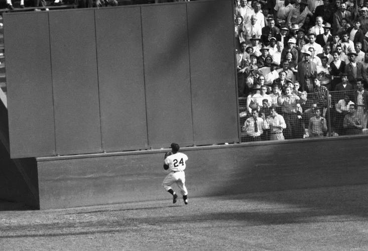 New York Giants’ Willie Mays makes a catch of a ball hit by Cleveland Indians’ Vic Wertz in Game 1 of the 1954 baseball World Series in New York’s Polo Grounds on Sept. 29, 1954.