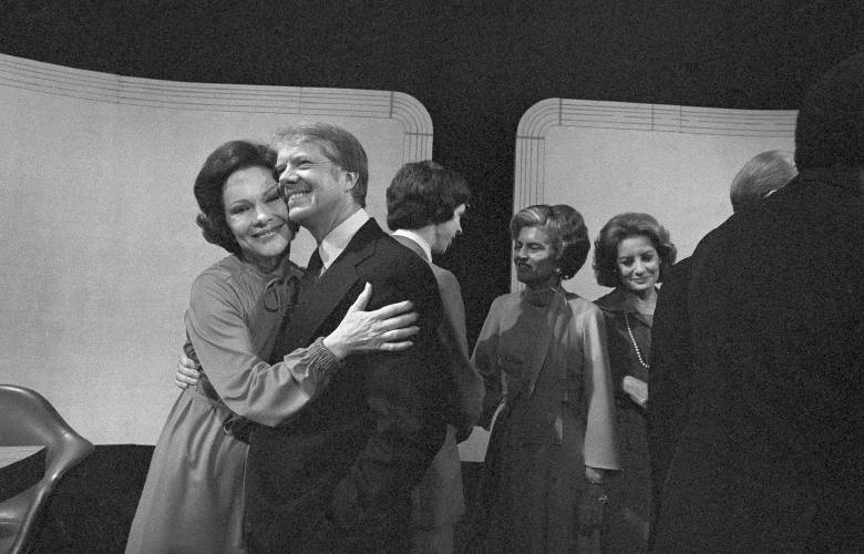 Democratic presidential candidate Jimmy Carter gets a hug from his wife, Rosalynn, after the third presidential debate on Oct. 22, 1976, Williamsburg, Va. (AP Photo, File)