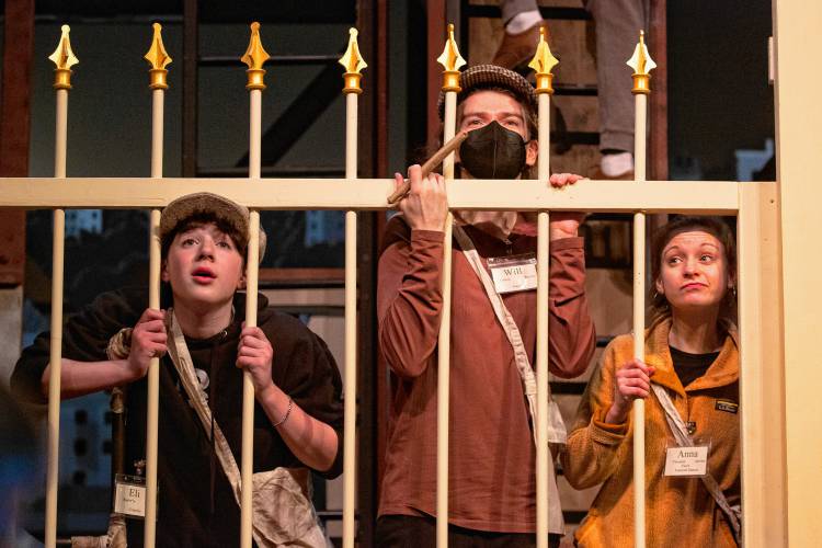 From left: Will Gracik, as Race, and Anna Plummer, as Finch, take part in a tech rehearsal of “Newsies.”