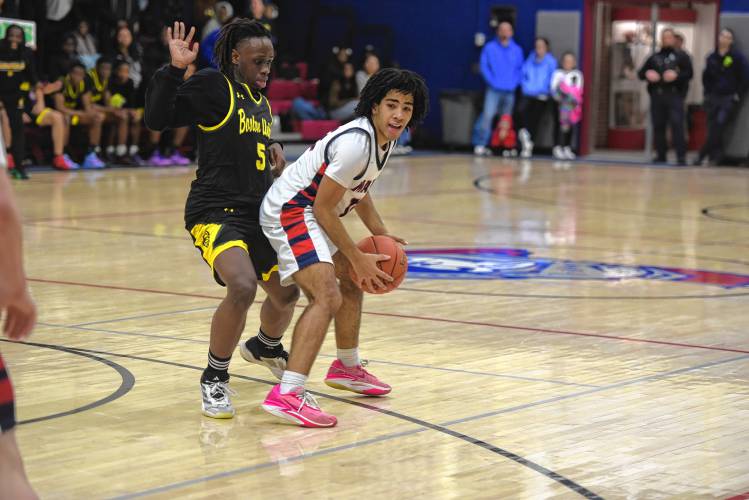 Mahar's Lian Lopez-Baez scans the court while defended by Boston International's Brivhonny Valcourt during an MIAA Div. 5 Round of 32 contest in Orange on Friday. 