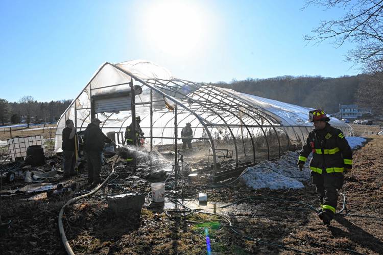 Firefighters extinguish a greenhouse fire on Jones Road in Deerfield on Tuesday afternoon. 