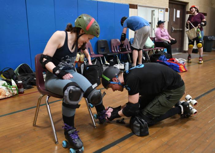 Members of the Pioneer Valley Roller Derby gear up for drills at Franklin Countys YMCA in Greenfield. 