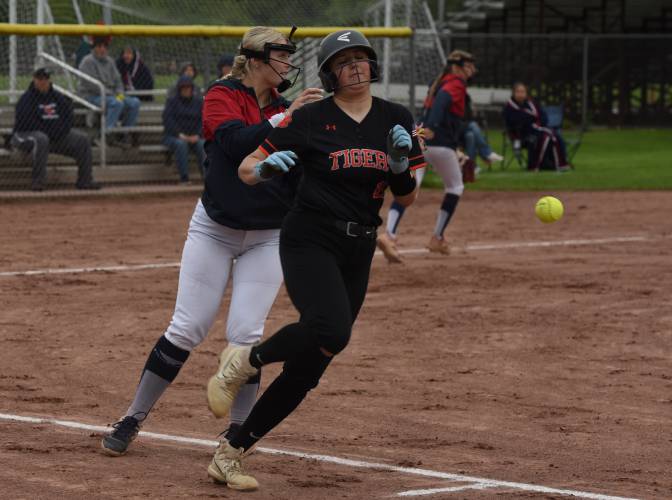 Frontier’s Sophia Pinardi, left, drops the ball after trying to tag out South Hadley base runner Grace Matyszewski, right, during the Redhawks’ game against the Tigers on Monday afternoon in South Deerfield.