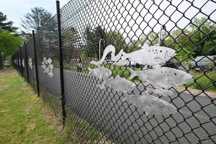 Franklin County Technical School students created aluminum fish silhouettes for the courtyard at the Turners Falls Fishway near the dam.