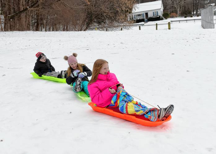Heading down the hill at Beacon Field are, from front, Layla Coffin, 11, sister Harper Coffin, 9, both of Bernardston, and Forrest Russell, 7, of Greenfield. Heading down the hill at Beacon Field are, from front, Layla Coffin, 11, sister Harper Coffin, 9, both of Bernardston, and Forrest Russell, 7, of Greenfield.