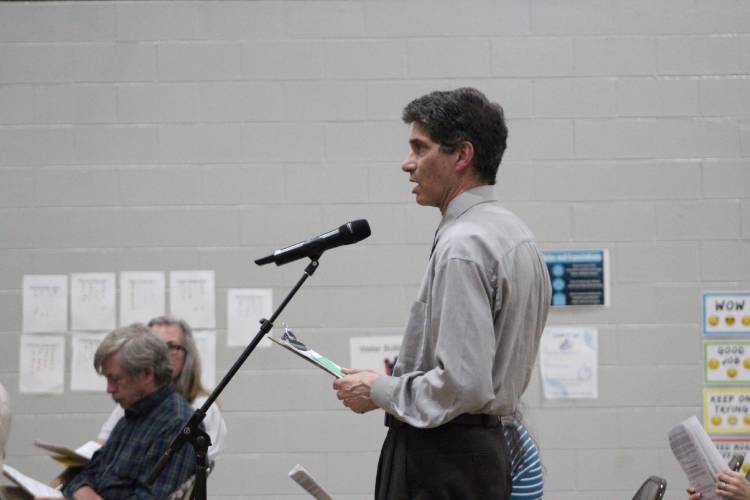 Aaron Falbel, a member of the Sunderland Human Rights Task Force, speaks on the land acknowledgment article at Friday’s Annual Town Meeting at Sunderland Elementary School.