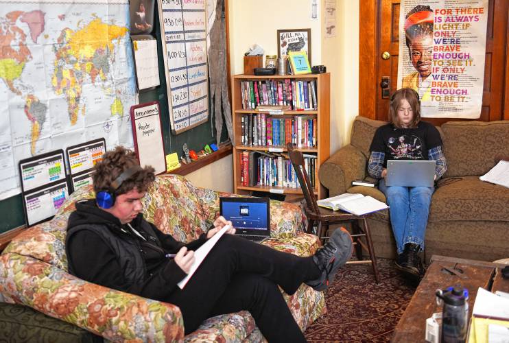 Owen Brown and Ainer Lautzenheiser study at Four Winds School in Gill on Thursday.