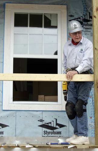 Former President Jimmy Carter pauses as he works on a Habitat for Humanity home in the Upper Ninth Ward of New Orleans, May 14, 2008. Carter and his wife, Rosalynn, were participating in a building project along the Gulf Coast in areas that were damaged by Hurricane Katrina.