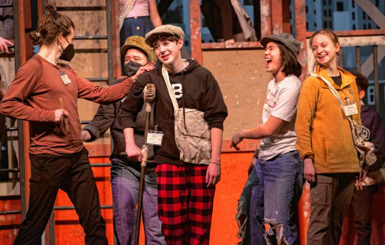 From left: Will Gracik, as Race, Robin Livingston, as Elmer, Eli Rochelle, as Crutchie, Kai Imperial Jewett, as Albert, and Anna Plummer, as Finch, take part in a tech rehearsal of “Newsies.”