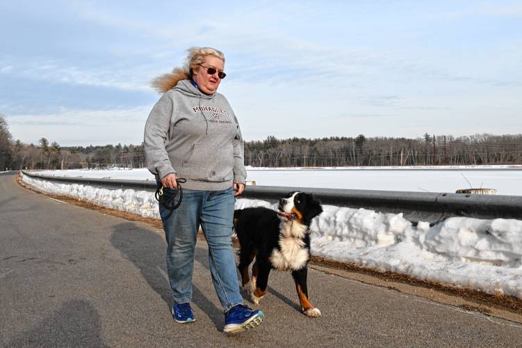 Montague resident Dr. Lauralyn Brown walks Porschia along Migratory Way in Turners Falls. Montague resident Dr. Lauralyn Brown walks Porschia along Migratory Way in Turners Falls.