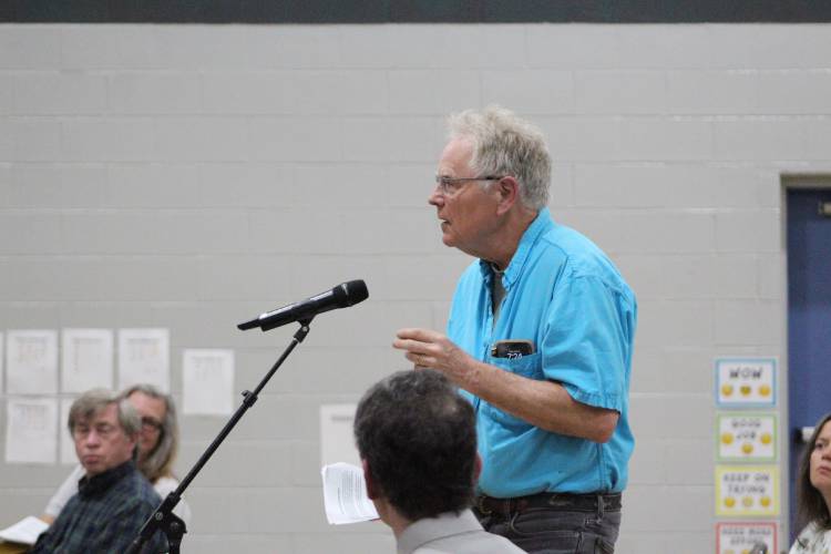 Sunderland resident Will Sillin speaks on the land acknowledgment article at Friday’s Annual Town Meeting at Sunderland Elementary School.
