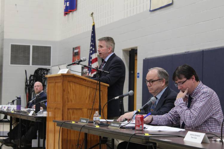 Deerfield Town Moderator Dan Graves and Selectboard members Tim Hilchey and Trevor McDaniel at Monday’s Annual Town Meeting at Frontier Regional School.