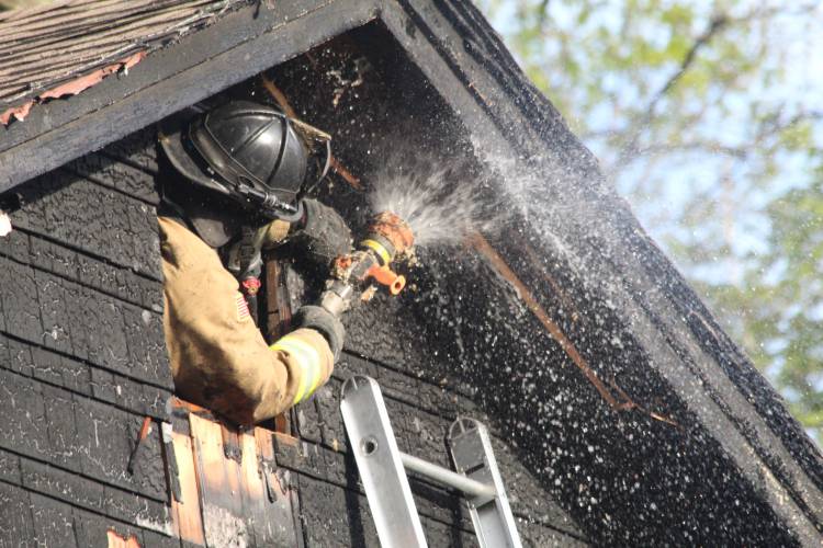 A fire at 88 Phillips St. in Greenfield damaged a home and garage Thursday evening. Firefighters knocked down the blaze in about 15 minutes, according to Greenfield Fire Chief Robert Strahan.