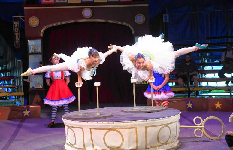 Performers balance on one hand at a Circus Smirkus performance at the Franklin County Fairgrounds in Greenfield on Monday. 