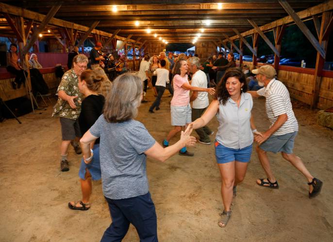 Attendees square dance to music by the Falltown String Band at the 2019 Heath Fair. The Heath Agricultural Society will hold a square dance fundraiser on Saturday, June 14, in the cattle barn at the Heath Fairgrounds. Attendees square dance to music by the Falltown String Band at the 2019 Heath Fair. The Heath Agricultural Society will hold a square dance fundraiser on Saturday, June 14, in the cattle barn at the Heath Fairgrounds.
