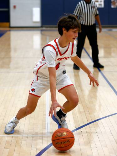 Frontier’s Eric Larsson (4) dribbles the ball against Drury in the second quarter Friday night at Goodnow Gymnasium in South Deerfield.