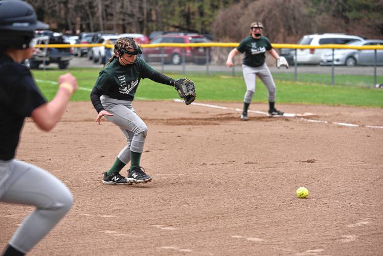 Gilmore and Farrell’s Kam Beck charges in for a ground ball during a game against Precision Driving on Saturday at Murphy Park. 