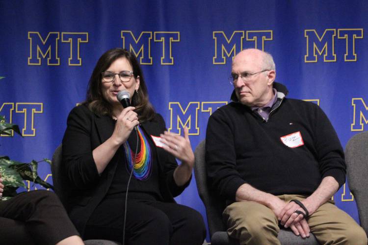 Ana Paula Schantz, a social studies teacher from Brazil, speaks about her experience immigrating to America while Ashfield resident Stewart “Buz” Eisenberg listens. Eisenberg was born and raised in the U.S., but his ancestors immigrated to America to escape persecution during the Holocaust.