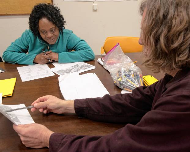 Thane Thomsen, an instructor with The Literacy Project, at right, teaches a high school equivalency test class in Easthampton to student Sharon Beeson-Nelson. The Literacy Project has expanded to Easthampton, its sixth location in the Pioneer Valley.