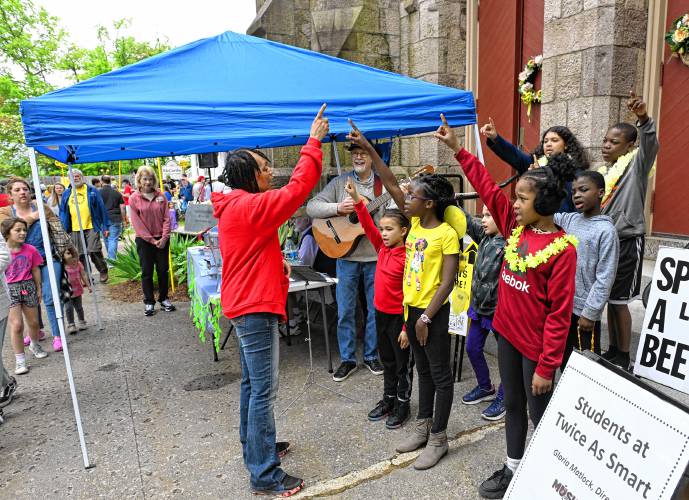 Twice As Smart students sing at the 14th Annual Bee Fest in Greenfield Saturday. 
