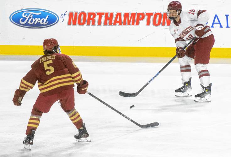 UMass right wing Cole O'Hara (19) keeps the puck from Boston College defenseman Drew Fortescue (5) during the college hockey game at the Mullins Center, Saturday, Feb. 15, 2025, in Amherst.