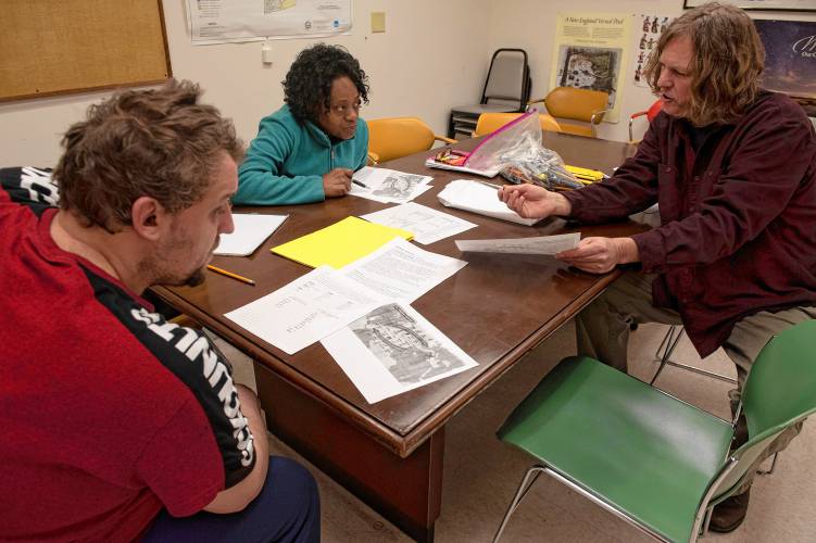 Thane Thomsen, an instructor with The Literacy Project, at right, teaches a high school equivalency test class in Easthampton to students Peter Morris and Sharon Beeson-Nelson. The Literacy Project has expanded to Easthampton, its sixth location in the Pioneer Valley.