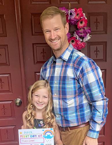 Greenfield’s new Assistant Superintendent of Teaching and Learning Stephen Sullivan stands next to his daughter, Piper Sullivan, on her first day of school.