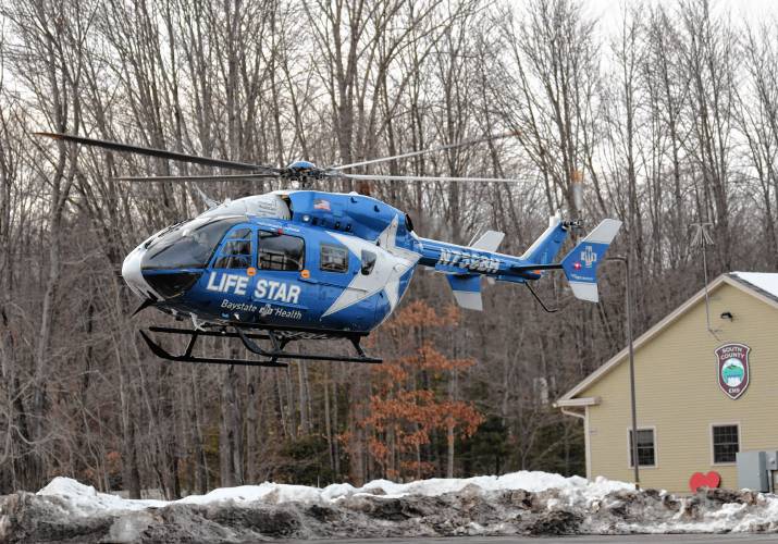 A LIFE STAR helicopter takes off from between the South County EMS building and the South Deerfield Fire District following an incident in which an Amtrak train struck an adult on the tracks on Monday afternoon.