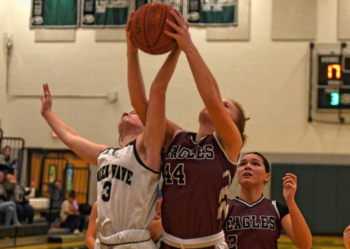 Greenfield’s Anna Bucala, left, fights for a rebound earlier this season against Easthampton.