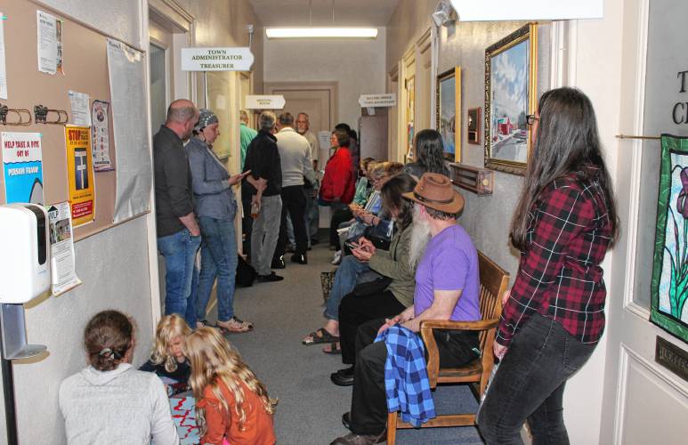 The possibility of having to close the Orange public libraries brought out so many people to the Orange Selectboard meeting on May 16 that some had to stay in the hallway.